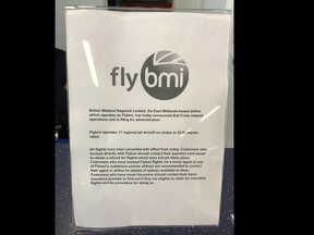 A notice informing passengers that flybmi flights have been cancelled following the collapse of the airline, at Bristol Airport in Bristol, England, Sunday, Feb. 17, 2019. Hundreds of passengers have been stranded by the abrupt collapse of the British regional airline Flybmi. The airline says it's filing for administration _ a British version of bankruptcy because of higher fuel costs and uncertainty caused by Britain's upcoming departure from the European Union. (PA via AP)