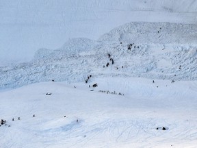 Rescue crew work on the avalanche site, at the ski resort of Crans-Montana, Switzerland, Tuesday, Feb. 19, 2019. Swiss response teams rescued at least a few people among those swept up and buried in a mid-afternoon avalanche Tuesday at the popular ski resort of Crans-Montana, police said. A frenzied search involving helicopters and rescuers "saved several people," said spokesman Steve Leger of the Valais police, but the state of their injuries was not immediately known.