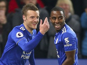 Leicester City's Jamie Vardy, left,  celebrates scoring his side's second goal of the game with teammate Domingos Ricardo Pereira, during the English Premier League soccer match between Leicester and Brighton,  at the King Power Stadium, in Leicester, England, Tuesday, Feb. 26, 2019.