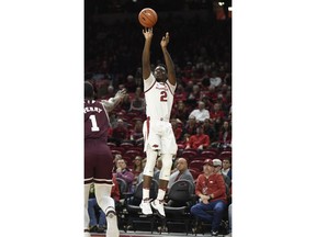 Arkansas forward Adrio Bailey (2) pulls up for a 3-point shot over Mississippi State defender Reggie Perry (1) during the first half of an NCAA college basketball game Saturday, Feb. 16, 2019, in Fayetteville, Ark.