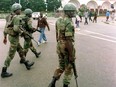 Zimbabwean national Army details patrol the streets of Harare's high density suburb of Highfields January 21. A husband and wife from Zimbabwe who were found complicit in crimes against humanity for their years working together in the Zimbabwe National Army have lost their dogged appeals to avoid deportation from Canada.