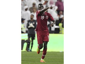 Qatar's forward Almoez Ali celebrates after scoring his side's second goal during the AFC Asian Cup semifinal soccer match between United Arab Emirates and Qatar at Mohammed Bin Zayed Stadium in Abu Dhabi, United Arab Emirates, Tuesday, Jan. 29, 2019.