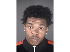 This undated police photo released Feb. 8, 2019, by the City of Atlanta Department of Corrections shows rapper Lil Baby whose real name is Dominique Jones. Jones, was arrested Thursday, Feb. 7 and faces charges of failing to use a turn signal, reckless driving and fleeing or attempting to elude police. (Atlanta Department of Corrections via AP)