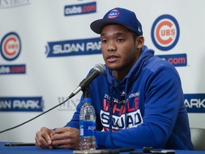 Chicago Cubs shortstop Addison Russell speaks at a press conference after a spring training baseball workout Friday, Feb. 15, 2019, in Mesa, Ariz.