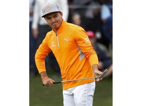 Rickie Fowler reacts to his missed birdie putt on the fourth green during the final round of the Phoenix Open PGA golf tournament, Sunday, Feb. 3, 2019, in Scottsdale, Ariz.