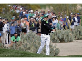 Justin Thomas hits from the second fairway during the third round of the Phoenix Open PGA golf tournament, Saturday, Feb. 2, 2019, in Scottsdale, Ariz.