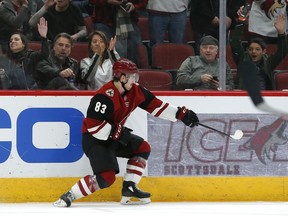 Arizona Coyotes right wing Conor Garland (83) celebrates after scoring a goal in the second period during an NHL hockey game against the Columbus Blue Jackets, Thursday, Feb. 7, 2019, in Glendale, Ariz.