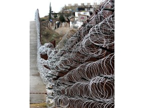 The additional concertina wire can be seen on the border fence in Nogales, Ariz, on Tuesday, Feb. 4, 2019. U.S.  The city council in Nogales, which sits on the border with Nogales, Mexico, is set to consider a proclamation Wednesday night condemning the use of concertina wire. It follows reports that U.S. military troops installed more horizontal layers of the wire along the downtown border fence over the weekend.