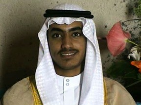 In this image from video released by the CIA, Hamza bin Laden is seen as an adult at his wedding. The never-before-seen video of Osama bin Laden's son and potential successor was released Nov. 1, 2017, by the CIA in a trove of material recovered during the May 2011 raid that killed the al-Qaida leader at his compound in Pakistan. The one hourlong video shows Hamza bin Laden, sporting a trimmed mustache but no beard, at his wedding. He is sitting on a carpet with other men.