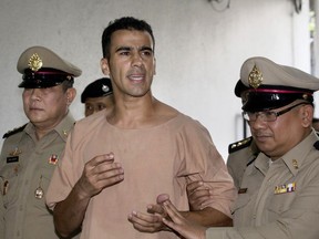 FILE -In this Monday, Feb. 4, 2019, file photo, detained Bahraini soccer player Hakeem al-Araibi arrives at the criminal court in Bangkok, Thailand. Australian Federal Police did not know Al-Araibi was a refugee who feared persecution in his homeland when the agency alerted Bahrain and Thailand that he was on a flight bound for Bangkok, a top police official said Monday.