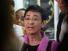 FILE - In this Jan. 22, 2018, file photo, Maria Ressa, CEO of the online news agency Rappler, talks to the media after attending the summons by the National Bureau of Investigation on the cyber libel complaint filed against Rappler five years ago in Manila, Philippines. Philippine authorities have arrested Ressa, Wednesday, Feb. 13, 2019, over a libel complaint which Amnesty International has condemned as "brazenly politically motivated."