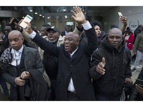 FILE - In this Jan. 16, 2019, file photo, supporters of former Ivory Coast President Laurent Gbagbo celebrate outside the International Criminal Court in The Hague, Netherlands, after judges ruled that Gbagbo and a former government minister should be released immediately following their acquittal on charges of involvement in deadly post-election violence in 2010. The acquittal at the International Criminal Court is causing some to celebrate his pending release but others fear a repeat of the deadly 2010-2011 post-election violence that led him to The Hague.
