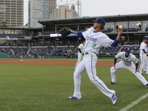 FILE - In this April 13, 2017 file photo, Hartford Yard Goats players warm up before the team's first ever game in Hartford, Conn. The Double-A team say they are going peanut-free at the 6,000-seat Dunkin' Donuts Park in 2019 to make the venue safer for people with nut allergies.
