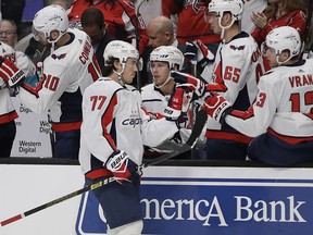 Washington Capitals' T.J. Oshie (77) is congratulated after scoring a goal against the San Jose Sharks in the first period of an NHL hockey game Thursday, Feb. 14, 2019, in San Jose, Calif.