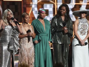 Lady Gaga, from left, Jada Pinkett Smith, Alicia Keys, Michelle Obama and Jennifer Lopez speak at the 61st annual Grammy Awards on Sunday, Feb. 10, 2019, in Los Angeles.