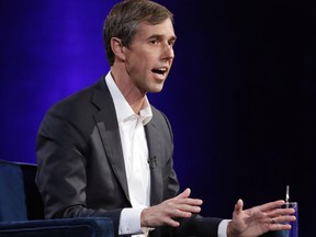 FILE - In this Tuesday, Feb. 5, 2019 file photo, former Democratic Texas congressman Beto O'Rourke gestures during an interview with Oprah Winfrey live on a Times Square stage at "SuperSoul Conversations," in New York. O'Rourke said Friday, Feb. 15, 2019, during a visit to Wisconsin that before deciding whether he will join the increasingly crowded field of Democrats running for president in 2020, he wants to meet with voters in the "most honest, raw, real way possible."