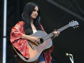FILE - In this Sept. 15, 2018 file photo, Kacey Musgraves performs during Music MidTown 2018 at Piedmont Park, in Atlanta. Chris Stapleton, Dan + Shay lead the 54th Academy of Country Music Awards with six nominations each while Grammy album of the year winner Musgraves comes in with five nominations. Reba McEntire, who is hosting the show for a record 16th time, announced the nominees in top categories on "CBS This Morning" on Wednesday, Feb. 20, 2019.