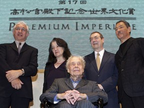 FILE - In this Oct. 17, 2005 file photo, winners, Yoshio Taniguchi, from left, Japanese architect, Martha Argerich, Argentine pianist, Merce Cunningham, front, American choreographer, Robert Ryman, American artist, and Issey Miyake, Japanese designer, of the 2005 Prince Takamatsu Memorial World Culture Award "the 17th Praemium Imperiale," pose for photographers during a press conference in Tokyo. Ryman, a minimalist known for experimenting with varying shades of white, has died at age 88. A spokeswoman for Pace Gallery, which represented him, says Ryman died Friday night, Feb. 8, 2019, at his New York City home.