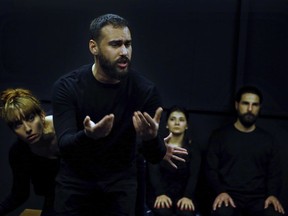 In this Friday, Feb. 8, 2019 photo, Syrian actor Hassan takes part in a playback theater at the end of a three-month training session, in Beirut, Lebanon. Syrians from different parts of their war-torn country have gathered inside a theater telling their stories that are later re-acted by a group of Syrians who have been training on playback theater.