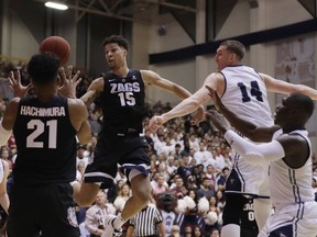 Gonzaga forward Brandon Clarke (15) passes to teammate Rui Hachimura (21) during the first half of an NCAA basketball game against Loyola Marymount Thursday, Feb. 14, 2019, in Los Angeles.