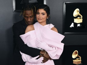 Travis Scott, left, and Kylie Jenner arrive at the 61st annual Grammy Awards at the Staples Center on Sunday, Feb. 10, 2019, in Los Angeles.