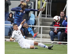 United States forward Gyasi Zardes (9) battles for the ball against Costa Rica midfielder Marvin Loria (25) during the first half of an international friendly soccer match on Saturday, Feb. 2, 2019, in San Jose, Calif.