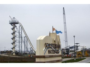 FILE - In this Oct. 30, 2018, file photo, crews dismantle the Verruckt waterslide at the Schlitterbahn water park in Kansas City, Kan. A judge has dismissed criminal charges against the Kansas water park owner and the designer of a 17-story slide on which a 10-year-old boy was decapitated in 2016. The Kansas City Star reports that Wyandotte County Judge Robert Burns found Friday, Feb. 22, 2019, that state prosecutors showed grand jurors inadmissible evidence in dismissing second-degree murder charges against Schlitterbahn owner Jeff Henry and designer John Schooley.