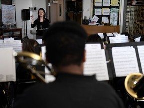 Michelle Koyama, executive principle of Skinner and Lake Middle Schools, teaches a mix of the beginner and concert bands at the school during the first day of the Denver Public Schools teachers strike, Monday, Feb. 11, 2019, in Denver.