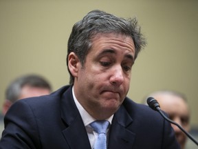 Michael Cohen, former personal lawyer to U.S. President Donald Trump, listens to closing statements during a House Oversight Committee hearing in Washington, D.C., U.S., on Wednesday, Feb. 27, 2019.