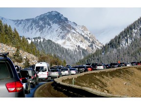 FILE - In this Jan. 7, 2018, file photo, traffic backs up on Interstate 70 near Silverthorne, Colo., a familiar scene on the main highway connecting Denver to the mountains. Heavy ski traffic along the interstate has been common for years, but Colorado's recent population boom is making it increasingly challenging for transportation officials who deal with a bare-bones budget.