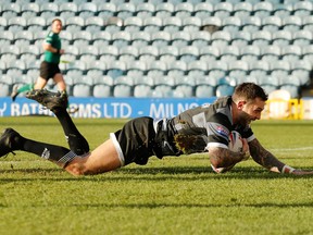 Toronto Wolfpack fullback Gareth O'Brien scores against the Rochdale Hornets during round 2 Betfred Championship rugby league action in Rochdale, United Kingdom, Sunday, Feb. 10, 2019.