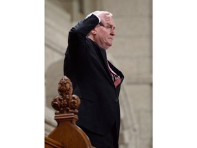 Kevin Vickers, ambassador to Ireland and former sergeant-at-arms,  salutes as he is recognized in the House of Commons on Parliament Hill in Ottawa on March 30, 2015. Vickers says he is retiring next month as Canada's ambassador to Ireland, potentially setting himself up for a bid to become New Brunswick Liberal leader.THE CANADIAN PRESS/Sean Kilpatrick