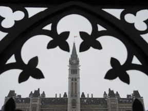 Freezing rain turns the Peace Tower white, Thursday January 24, 2019 in Ottawa.