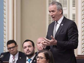 Quebec Agriculture, Fisheries and Food Minister Andre Lamontagne responds to the Opposition during question period at the National Assembly in Quebec City, Tuesday, Dec. 4, 2018. Lamontagne says he went too far when he endorsed the firing of a whistleblowing bureaucrat who had raised concerns about pesticide use.THE CANADIAN PRESS/Jacques Boissinot