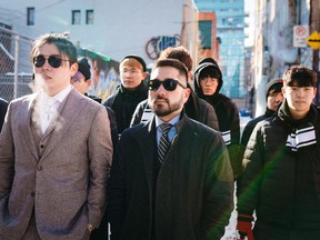 Head coach Beoumjun (Bishop) Lee, left, GM Jaesun (Jae) Won, centre, walk with members of the Toronto Defiant during a recent visit to Toronto. The esports team opens play Friday in the Overwatch League.THE CANADIAN PRESS/HO, The Toronto Defiant *MANDATORY CREDIT*