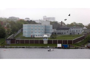 Her Majesty's Penitentiary, a minimum security penitentiary in St. John's, N.L., overlooks Quidi Vidi Lake on June 9, 2011. A new report on four inmate deaths says Newfoundland's prisons are suffering a mental health crisis that the current system cannot fix.