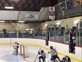 Young hockey players fall after stepping onto the ice in Lunenburg, N.S. in this undated handout photo taken from video. Young players of a Halifax-area hockey team faced off with an unusual opponent as they took the ice for a game over the weekend: a large step. The seven- and eight-year-olds had trouble navigating the deep drop, which caused many of the Bedford Blues novice hockey players to fall as their skates hit the ice in Lunenburg, N.S., to play against the South Shore Lumberjacks.THE CANADIAN PRESS/HO, Jesse Rodgers *MANDATORY CREDIT*