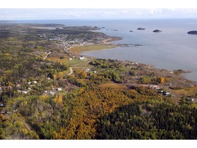 An aerial view of Fort Chipewyan, Alta., on the boundary of Wood Buffalo National Park is shown on Monday, Sept. 19, 2011. The federal government intends to save the international heritage status of Canada's largest national park by increasing staffing, better monitoring the tailings from the oil sands, and artificially recreating spring flooding to rejuvenate the park's waterways.