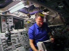 In this image from NASA TV, Dave Williams, astronaut from the Canadian Space Agency, is shown on the flight deck of the shuttle Endeavour, Thursday, Aug. 9, 2007. The Canadian Space Agency says it wants to hire ex-astronaut Williams to help figure out how to get humans to Mars and back in one piece THE CANADIAN PRESS/AP-NASA TV