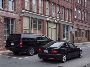 The building where businessman Richard Oland was found dead is seen in Saint John, N.B. on Monday, July 14, 2014. Patterns of use on electronic devices in Richard Oland's office are being scrutinized by Crown prosecutors in an attempt to pinpoint what time the multi-millionaire was bludgeoned to death.