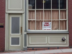 The building where businessman Richard Oland was found dead is seen in Saint John, N.B. on July 14, 2014. Richard Oland's final moments as he was bludgeoned to death are being traced in the patterns of bloodstains and spatter that radiated around his body at the murder trial of his son, Dennis Oland.