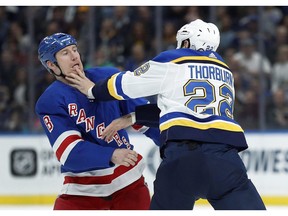 New York Rangers' Cody McLeod, left, and St. Louis Blues' Chris Thorburn fight during the first period of an NHL hockey game Saturday, March 17, 2018, in St. Louis. The Nashville Predators have made a pair of trades adding size and toughness by adding Brian Boyle from the New Jersey Devils and bringing back forward McLeod from the New York Rangers.THE CANADIAN PRESS/AP/Jeff Roberson