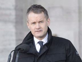 Indigenous Services Minister Seamus O'Regan addresses the media following a swearing in ceremony at Rideau Hall in Ottawa on January 14, 2019. Indigenous Services Minister Seamus O'Regan says he will visit a northern Ontario First Nation to examine its housing situation at the request of the community's chief. O'Regan spoke to the chief of Cat Lake First Nation earlier Friday and the two agreed on an action plan that includes speeding up the delivery of materials to complete a seven-unit housing complex and for other repairs and new construction.