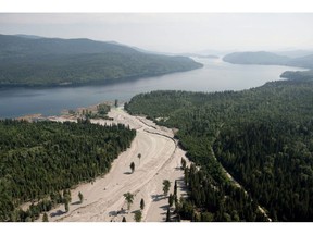 Contents from a tailings pond is pictured going down the Hazeltine Creek into Quesnel Lake near the town of Likely, B.C. Tuesday, August, 5, 2014. British Columbia's mines minister says the Mount Polley tailings pond collapse is behind changes to increase safety and regulation enforcement in provincial mining operations.THE CANADIAN PRESS/Jonathan Hayward