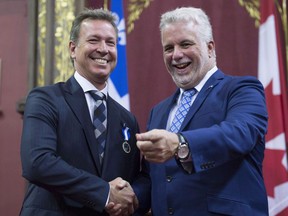 Famous chef Ricardo Larrivee is decorated as Chevalier by Quebec Premier Philippe Couillard at the Ordre national du Quebec ceremony, Thursday, June 22, 2017 at the legislature in Quebec City. Ricardo Media is shutting down its English-language food magazine, citing high distribution costs and shift towards digital media.