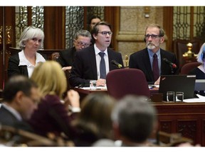 Stephane Perrault (left), Chief Electoral Officer of Canada, and Yves Cote, Commissioner of Canada Elections, appear as witness for a Committee of the Whole regarding Bill C-76 (Elections Modernization Act) in the Senate on Parliament Hill in Ottawa on November 6, 2018. Canada's chief electoral watchdog says there's not much his independent agency can do to counter fake news circulated about a candidate in the midst of an election. Stephane Perrault says if the fake information appears in an advertisement, there are some "minimal rules" that cover impersonation of parties, candidates or Elections Canada officials and some elements of disinformation.