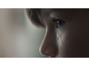 A still from the public service announcement "Boys Don't Cry," is shown in a handout. It lasts just three minutes but it covers a boy's entire childhood, from his toddler days hearing phrases like "I need you to be brave," to being bullied in elementary school and roughhousing with teenage friends. In conjunction with Anti-Bullying Day in Canada on Wednesday, advocacy group White Ribbon is releasing "Boys Don't Cry," a public service announcement by Oscar-nominated Toronto director Hubert Davis that paints a powerful picture of the origins of gender-based violence and toxic masculinity. THE CANADIAN PRESS/HO-Courtesy of White Ribbon MANDATORY CREDIT