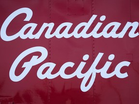 A Canadian Pacific Rail logo is shown on the side of a caboose at the company's headquarters in Calgary, Thursday, May 1, 2014. Documents show a federal investigator flagged labour code contraventions after a Canadian Pacific train conductor died in a workplace accident in downtown Calgary last November.