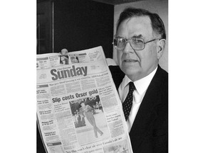 Clark Davey, publisher of the Montreal Gazette, displays a mock-up of the new Sunday edition of the Gazette in Montreal on Feb. 26, 1988. Davey, a former publisher of newspapers in Ottawa, Vancouver and Montreal and a driving force behind one of the most prestigious journalism awards in Canada has died.