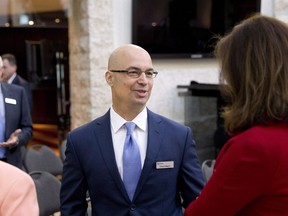 Chuck Magro, then-CEO and President of Agrium before the company merged with Potash Corporation of Saskatchewan to form Nutrien, chats with people attending prior to the company's annual general meeting in Calgary on Wed., May 4, 2016.